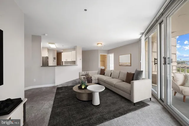 a living room with furniture and a table