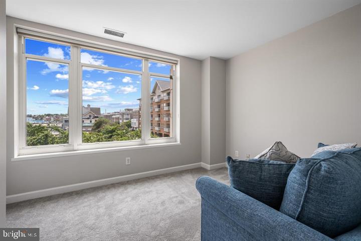 100 Harborview Drive, Unit 212 Baltimore, MD 21230 - Photo 21 of 29 a living room with furniture and a window