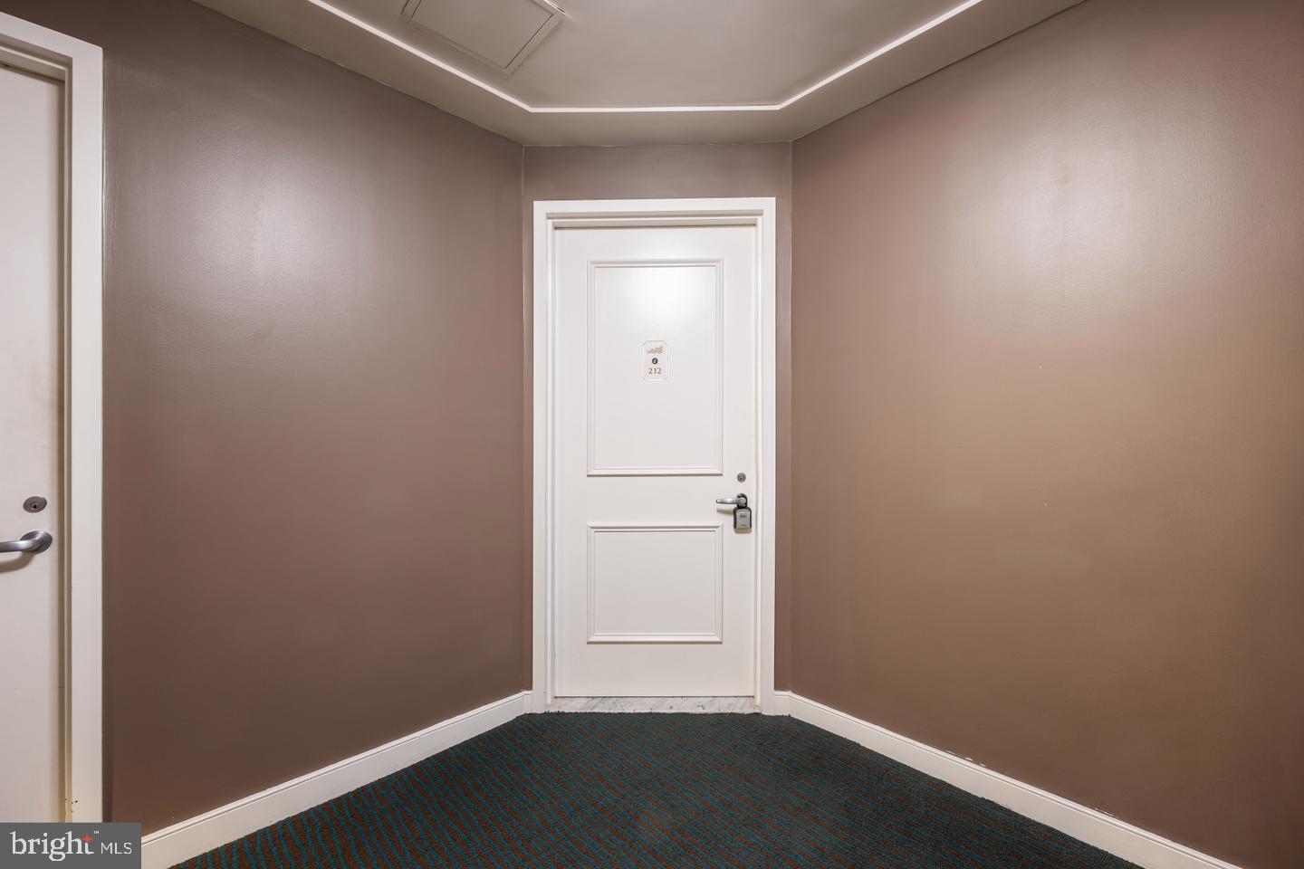 100 Harborview Drive, Unit 212 Baltimore, MD 21230 - Photo 4 of 29 an empty room with a door