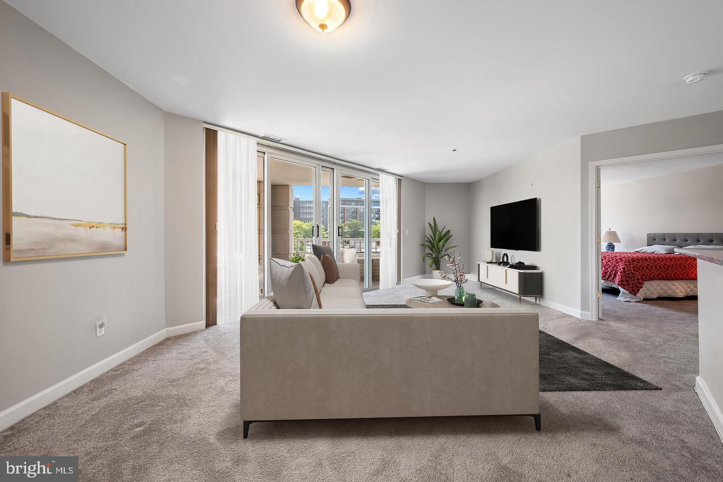 100 Harborview Drive, Unit 212 Baltimore, MD 21230 - Photo 9 of 29 a living room with furniture and a flat screen tv