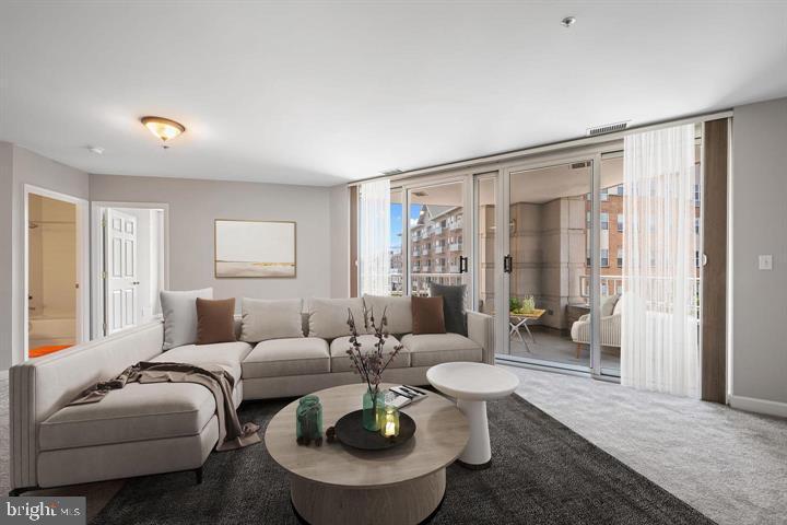 100 Harborview Drive, Unit 212 Baltimore, MD 21230 - Photo 10 of 29 a living room with furniture and a large window