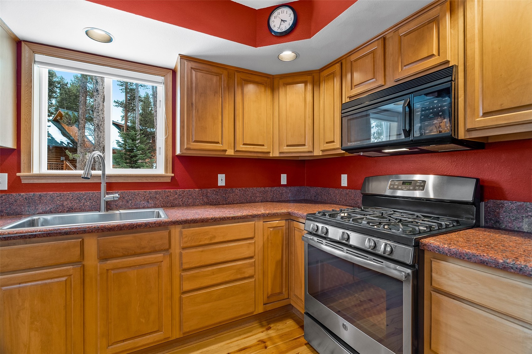696 Moonstone Road Breckenridge, CO 80424 - Photo 12 of 34 a kitchen with stainless steel appliances granite countertop a stove a sink and a microwave