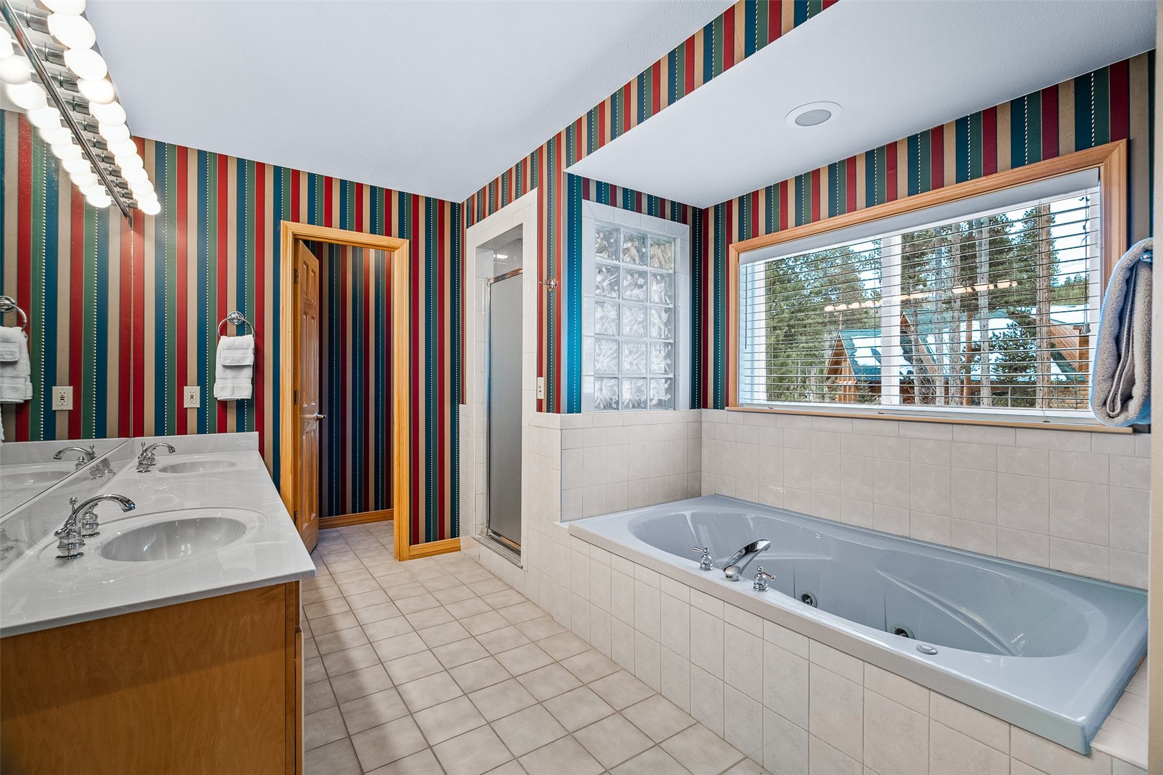 696 Moonstone Road Breckenridge, CO 80424 - Photo 18 of 34 a bathroom with a tub sink and a mirror