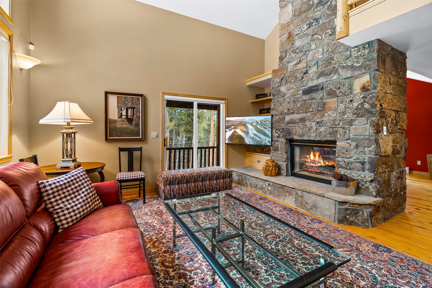 696 Moonstone Road Breckenridge, CO 80424 - Photo 2 of 34 a living room with furniture and a fireplace