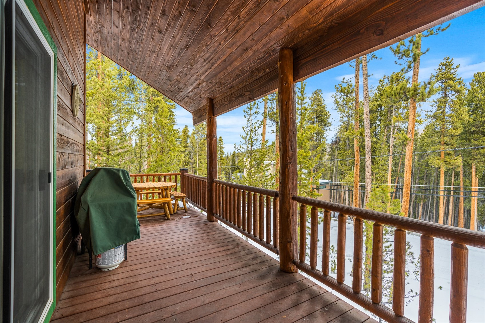 696 Moonstone Road Breckenridge, CO 80424 - Photo 29 of 34 a view of a two chairs in the balcony with wooden floor and outside view