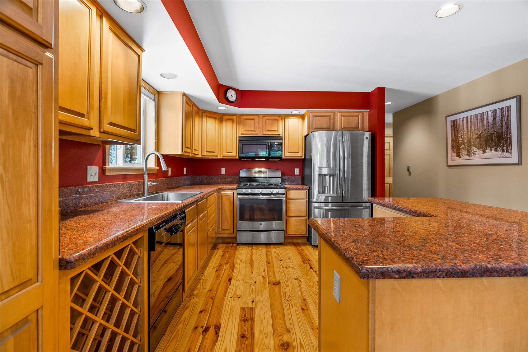696 Moonstone Road Breckenridge, CO 80424 - Photo 4 of 34 a kitchen with stainless steel appliances granite countertop a stove and a refrigerator