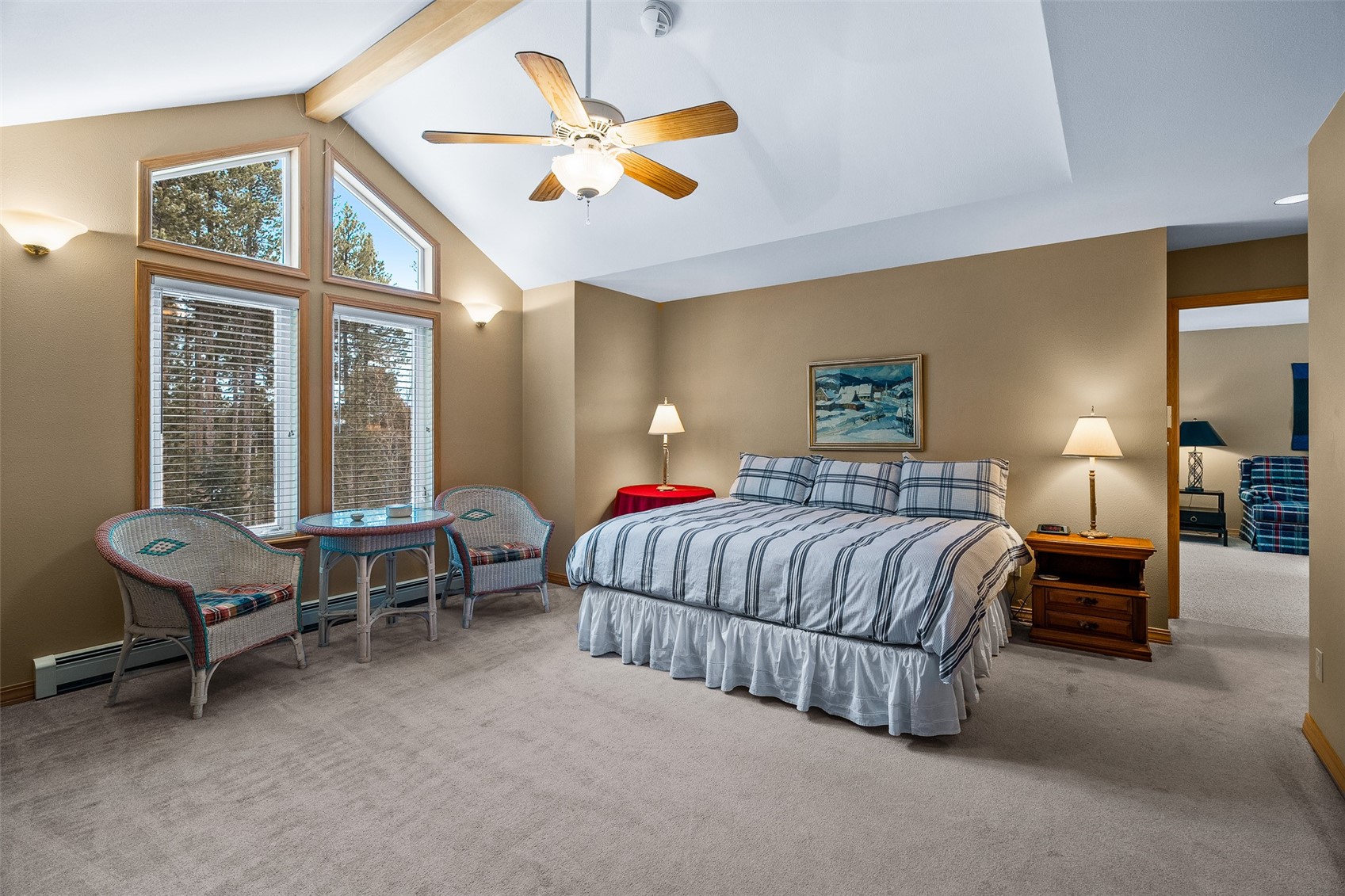 696 Moonstone Road Breckenridge, CO 80424 - Photo 5 of 34 a bedroom with a bed and a chandelier