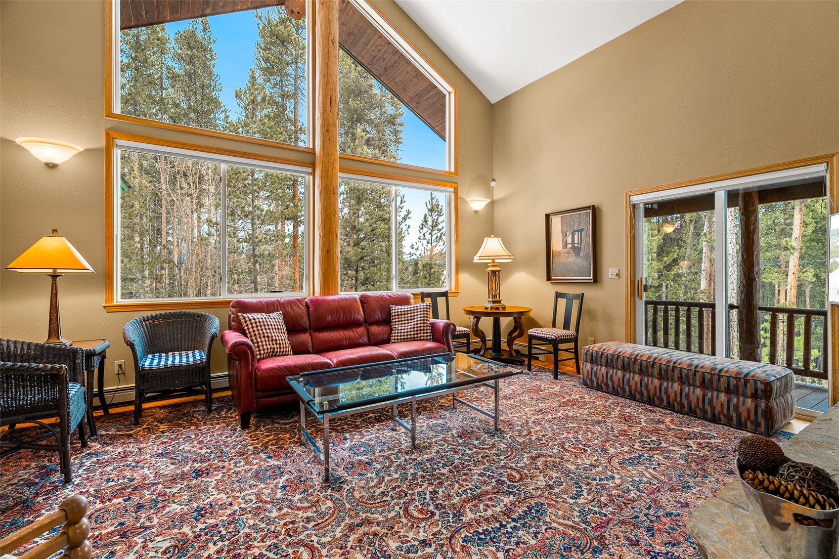 696 Moonstone Road Breckenridge, CO 80424 - Photo 7 of 34 a living room with furniture and a floor to ceiling window
