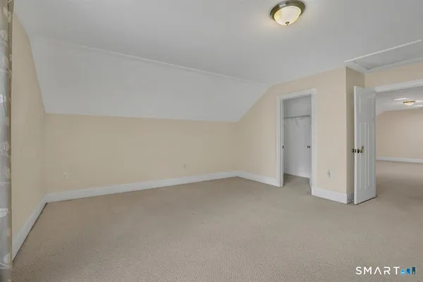 an empty room with a empty space and windows
