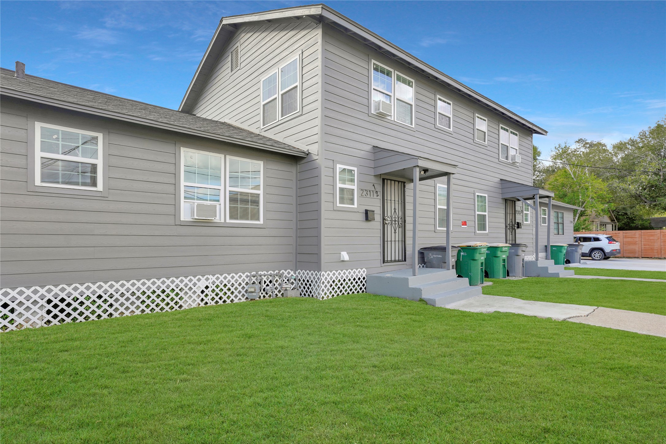 a front view of a house with a yard