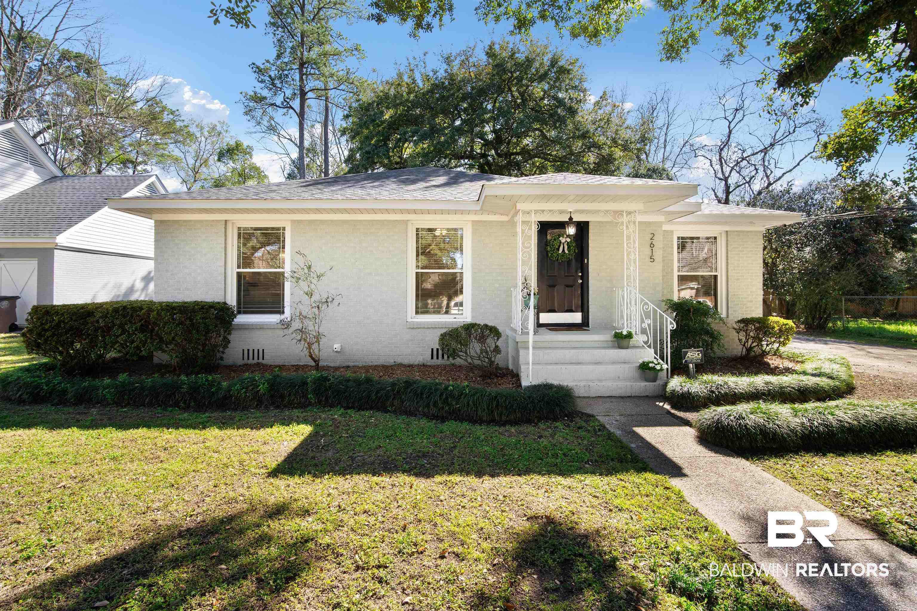 2615 Walton Avenue Mobile, AL 36606 - Photo 2 of 33 View of front of house with crawl space, brick siding, and a front yard