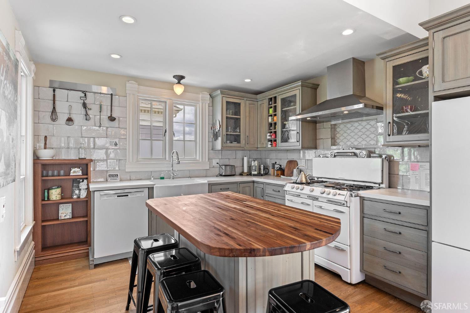 1918 Broadway Alameda, CA 94501 - Photo 15 of 28 a kitchen with a table chairs stove and cabinets