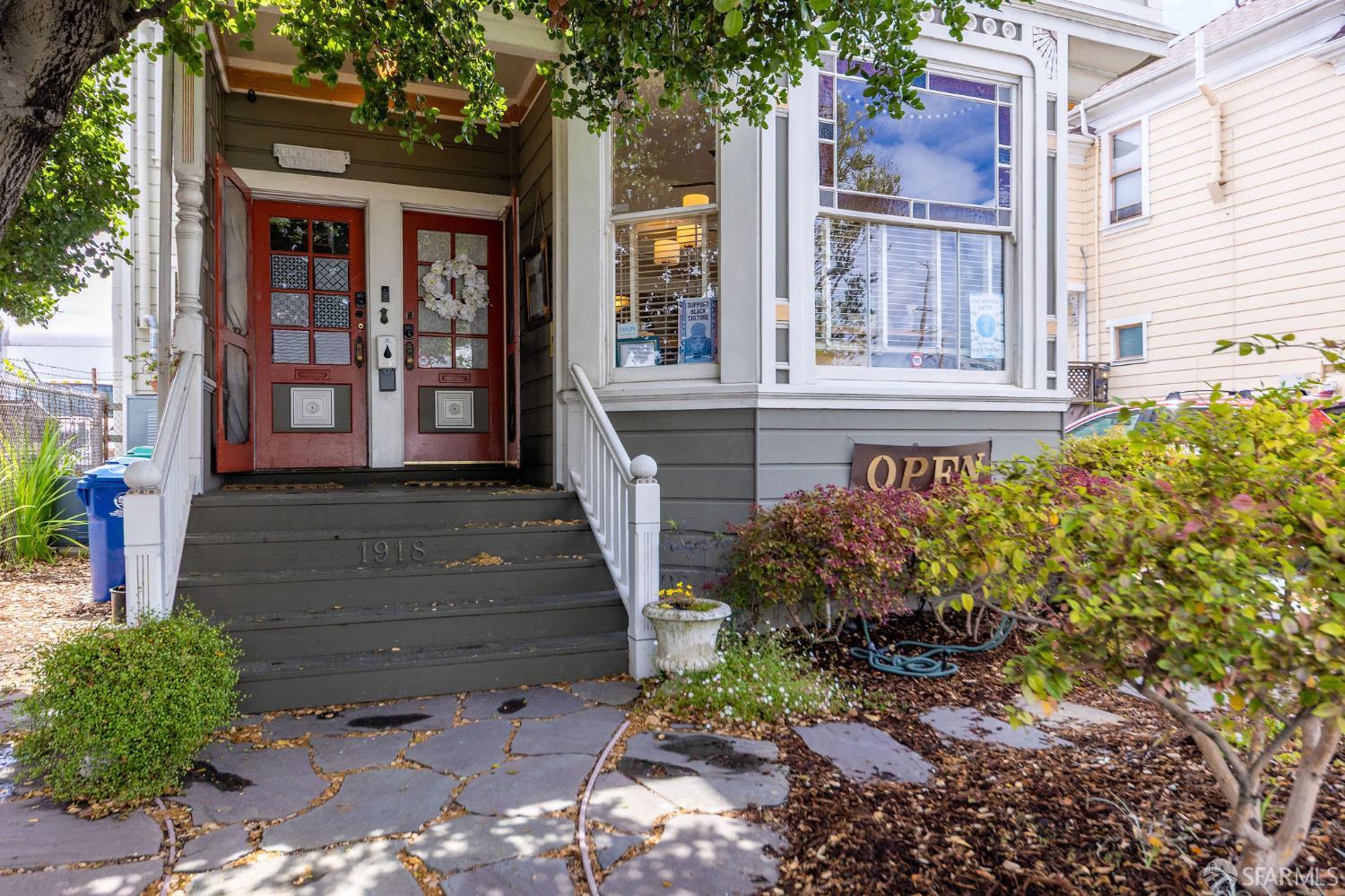 1918 Broadway Alameda, CA 94501 - Photo 2 of 28 a front view of a house with a yard