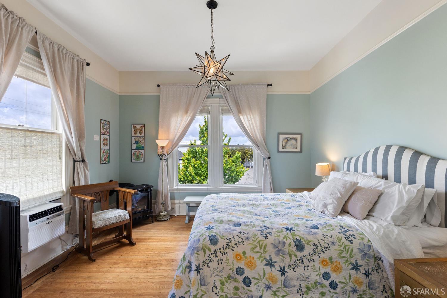 1918 Broadway Alameda, CA 94501 - Photo 21 of 28 a bedroom with a bed a couch and a window