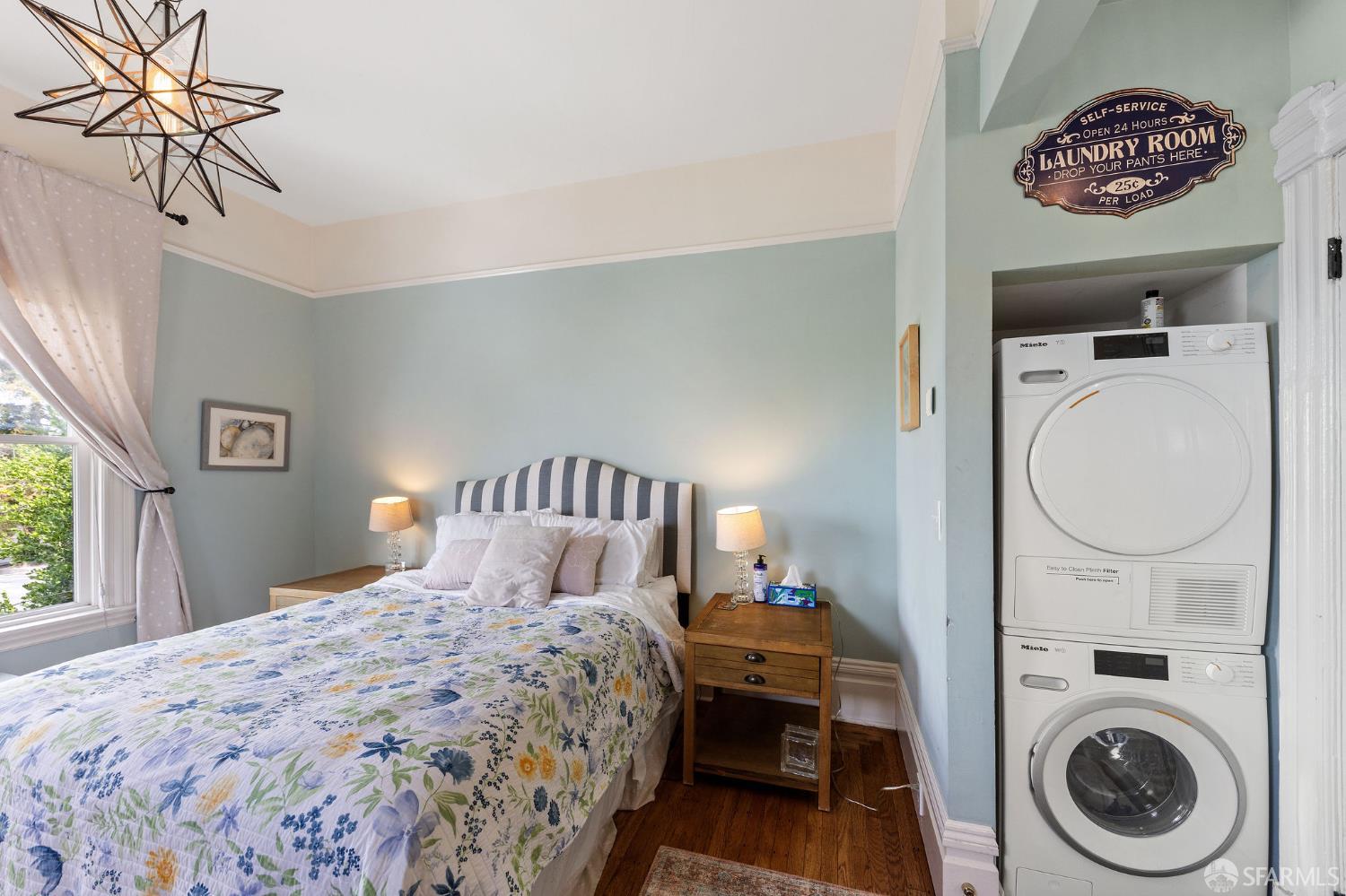 1918 Broadway Alameda, CA 94501 - Photo 24 of 28 a bedroom with a bed and a chandelier