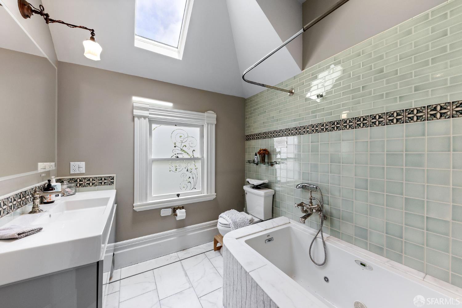1918 Broadway Alameda, CA 94501 - Photo 26 of 28 a bathroom with a tub sink and mirror