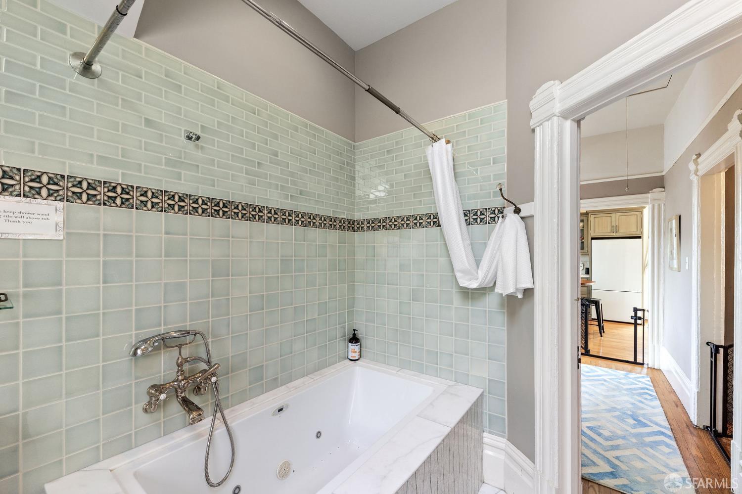 1918 Broadway Alameda, CA 94501 - Photo 27 of 28 a bathroom with a bath tub