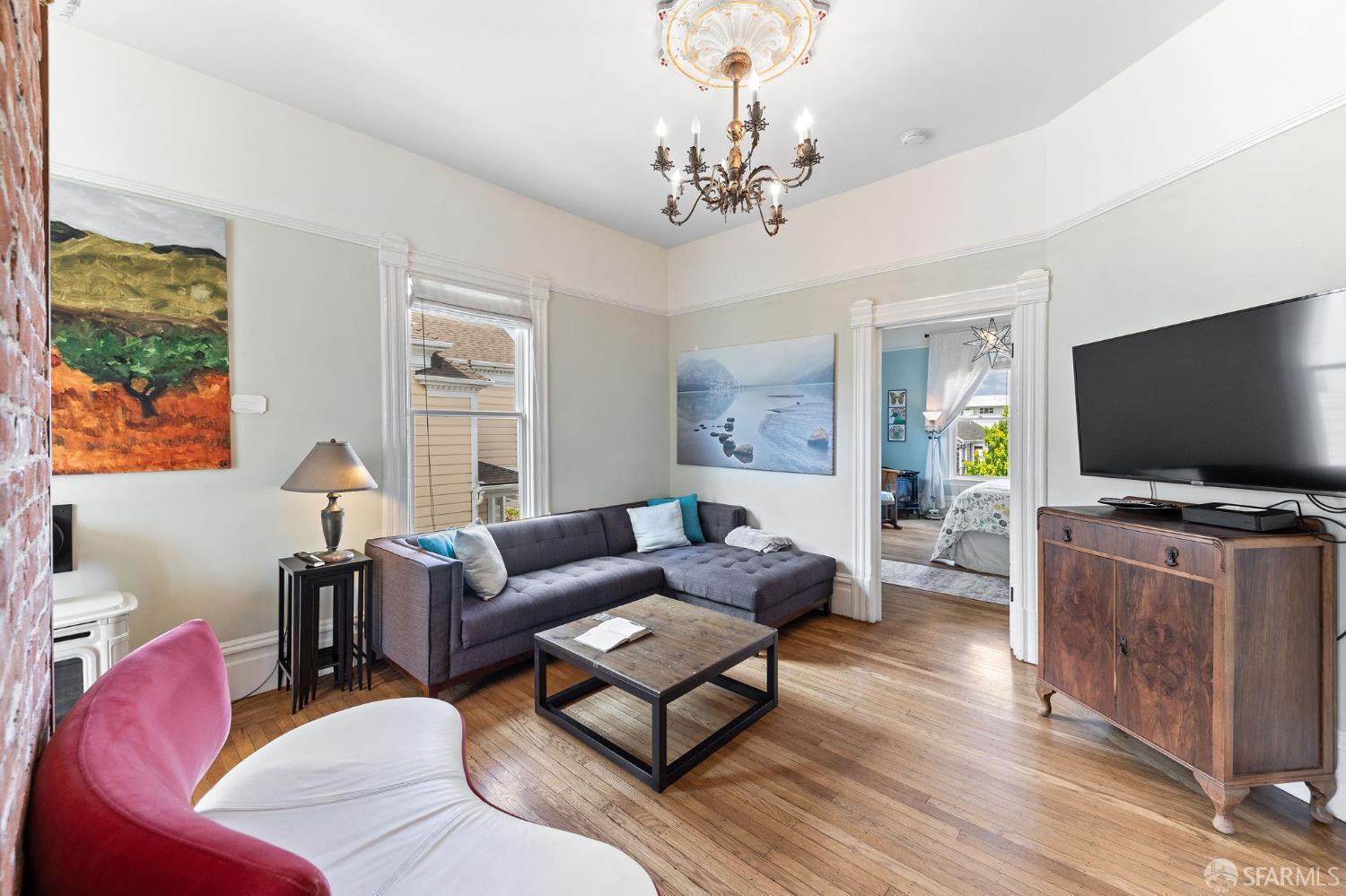 1918 Broadway Alameda, CA 94501 - Photo 9 of 28 a living room with furniture and a flat screen tv