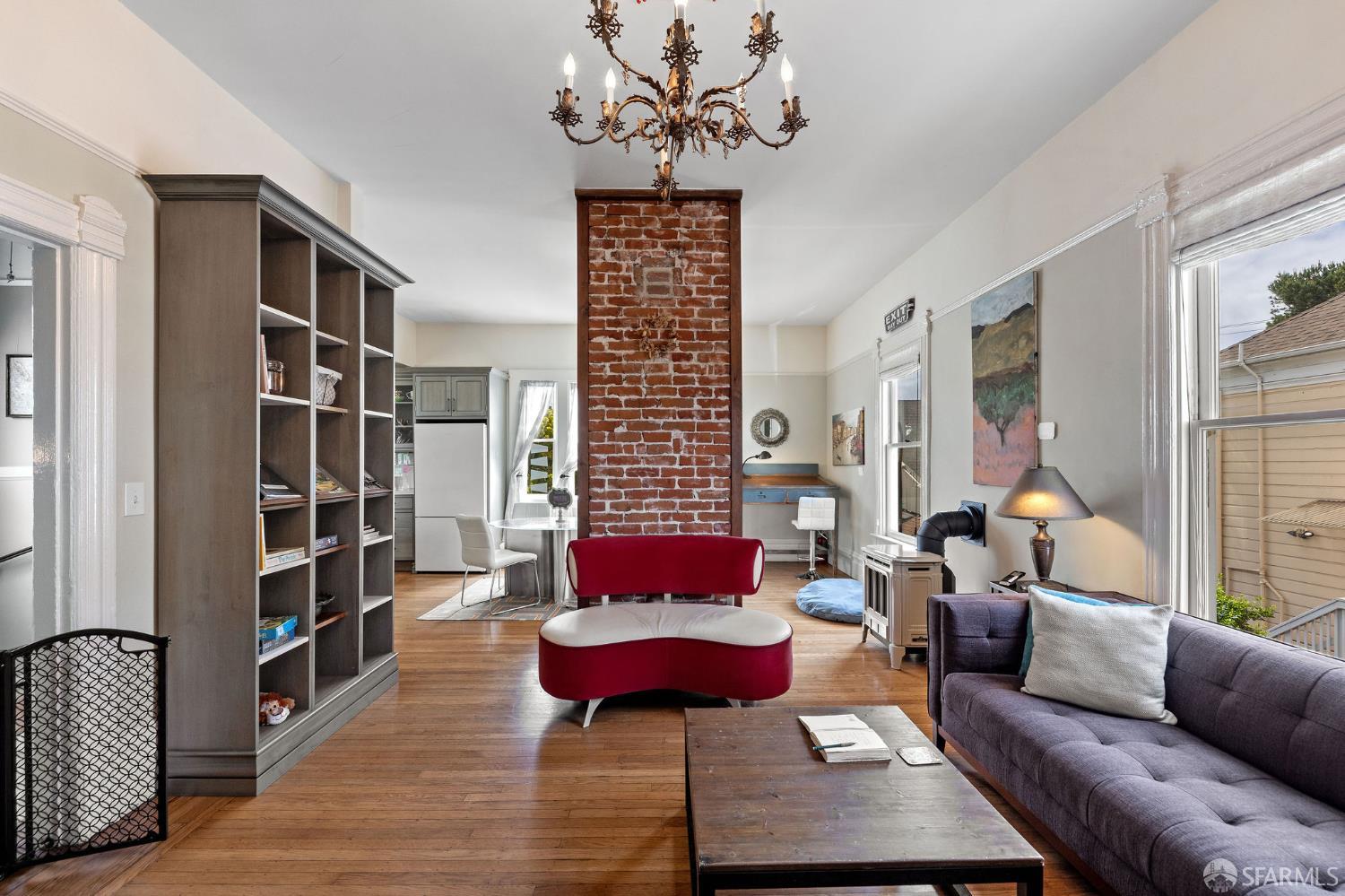 1918 Broadway Alameda, CA 94501 - Photo 10 of 28 a living room with furniture and a book shelf