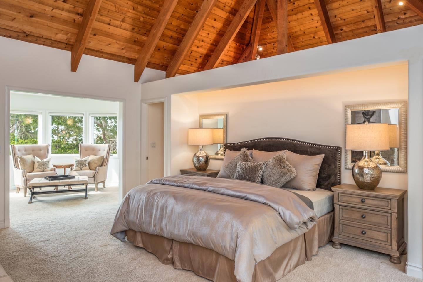 1465 Oleada Road Pebble Beach, CA 93953 - Photo 13 of 30 a bedroom with a large bed and a window with outer view