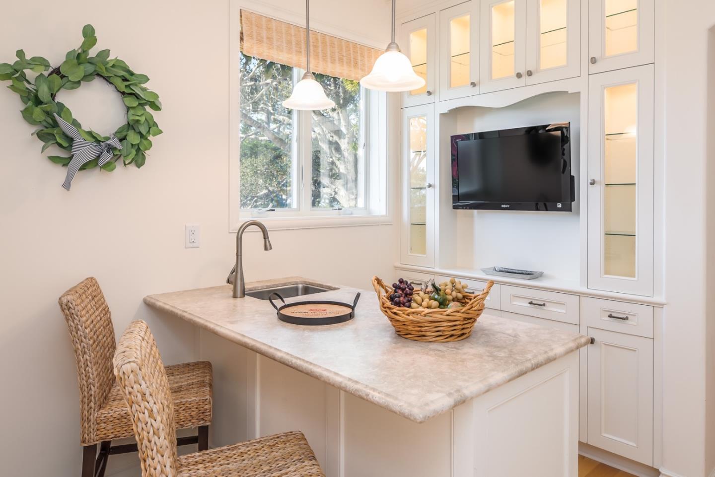 1465 Oleada Road Pebble Beach, CA 93953 - Photo 18 of 30 a kitchen with a table and chairs