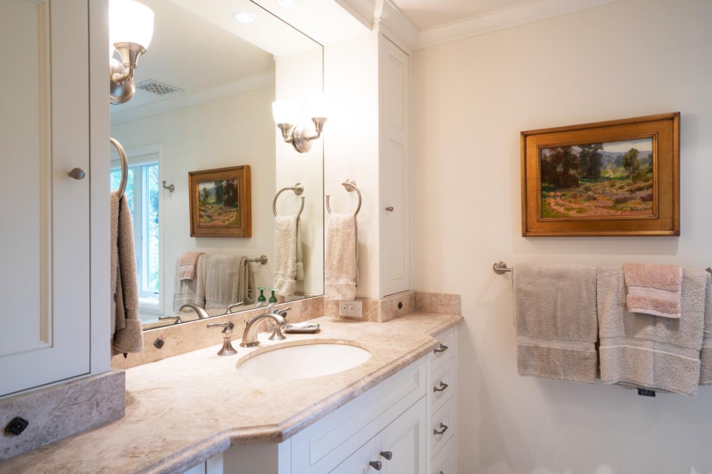 1465 Oleada Road Pebble Beach, CA 93953 - Photo 20 of 30 a bathroom with a granite countertop sink mirror and a