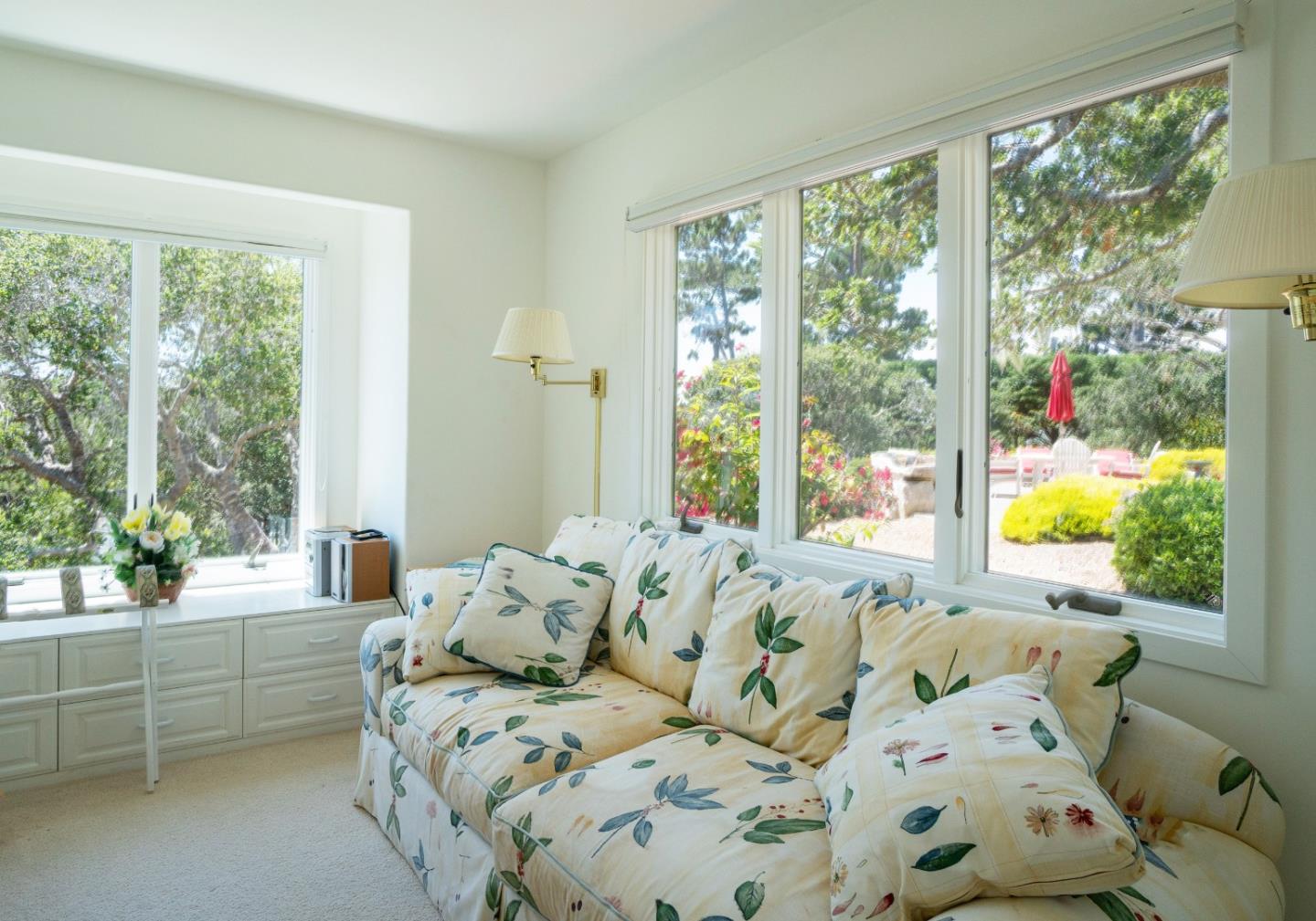 1465 Oleada Road Pebble Beach, CA 93953 - Photo 23 of 30 a bed sitting in a bedroom next to a window