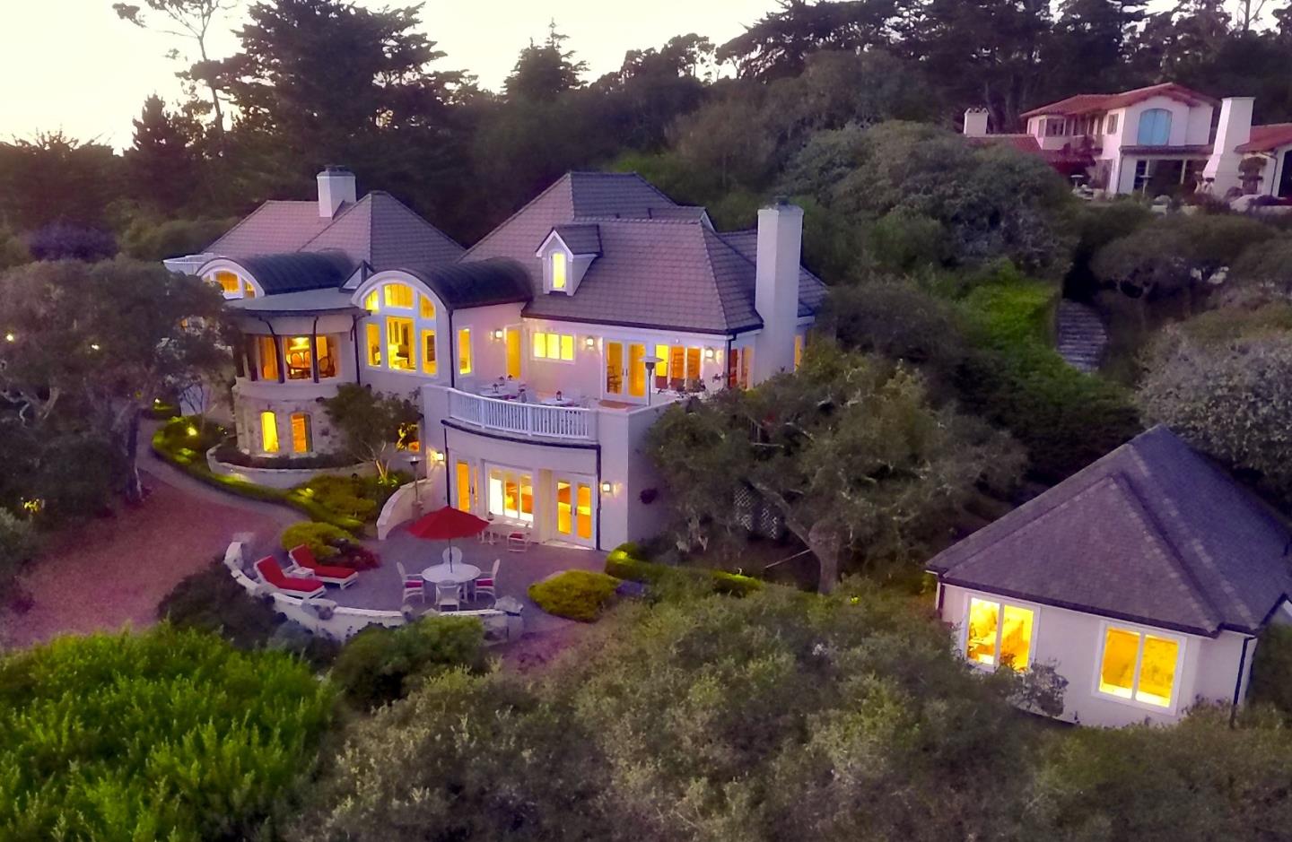 1465 Oleada Road Pebble Beach, CA 93953 - Photo 29 of 30 a view of a house with a yard and a car park