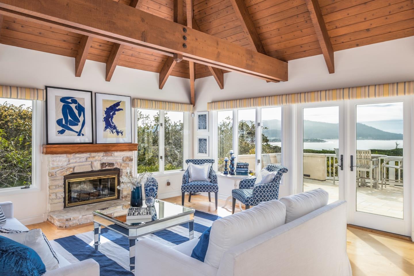 1465 Oleada Road Pebble Beach, CA 93953 - Photo 7 of 30 a living room with furniture a fireplace and a large window