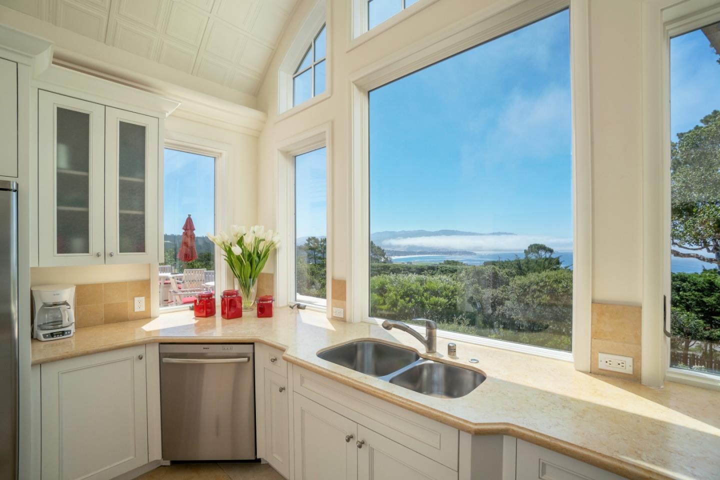 1465 Oleada Road Pebble Beach, CA 93953 - Photo 10 of 30 a kitchen with a sink and a large window