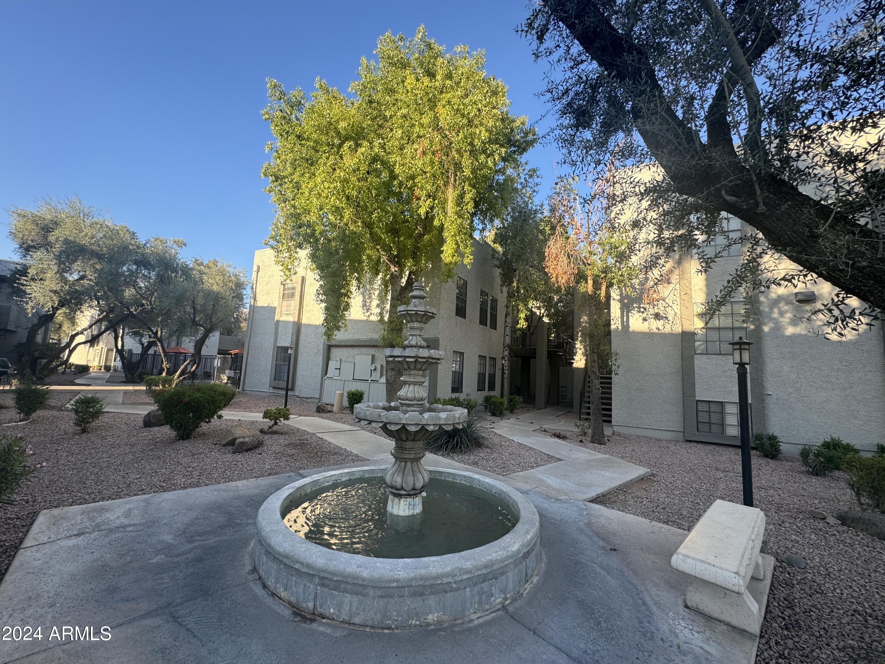 8020 East Thomas Road, Unit 226 Scottsdale, AZ 85251 - Photo 3 of 16 a view of a house with a backyard