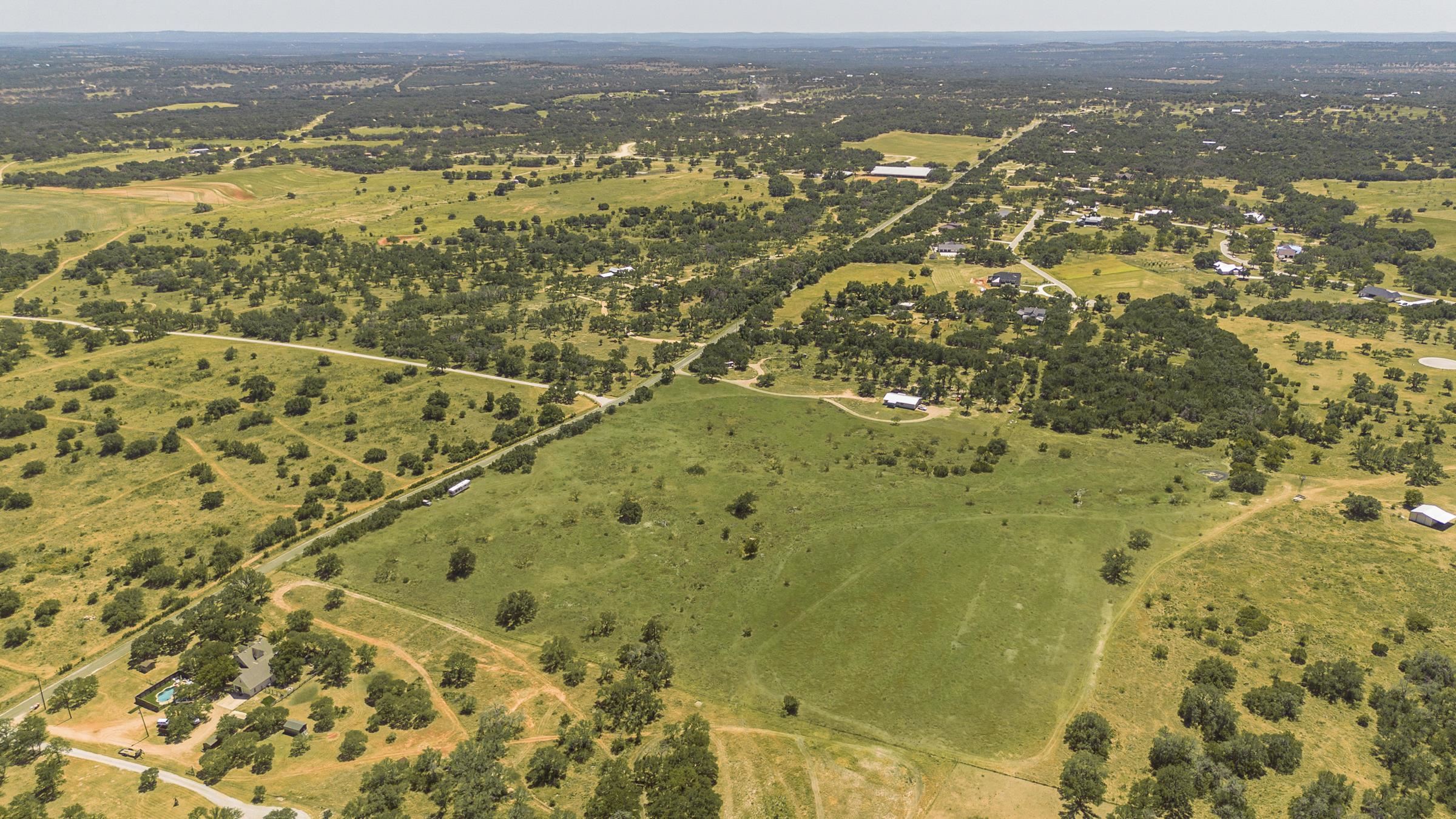 2965 Old Marble Falls Road Round Mountain, TX 78663 - Photo 6 of 28 an aerial view of residential houses with ocean view