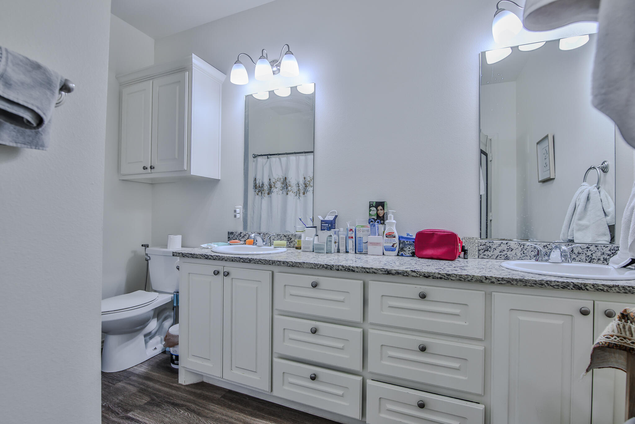 6902 20th Street Lubbock, TX 79407 - Photo 12 of 20 a bathroom with a sink and a mirror