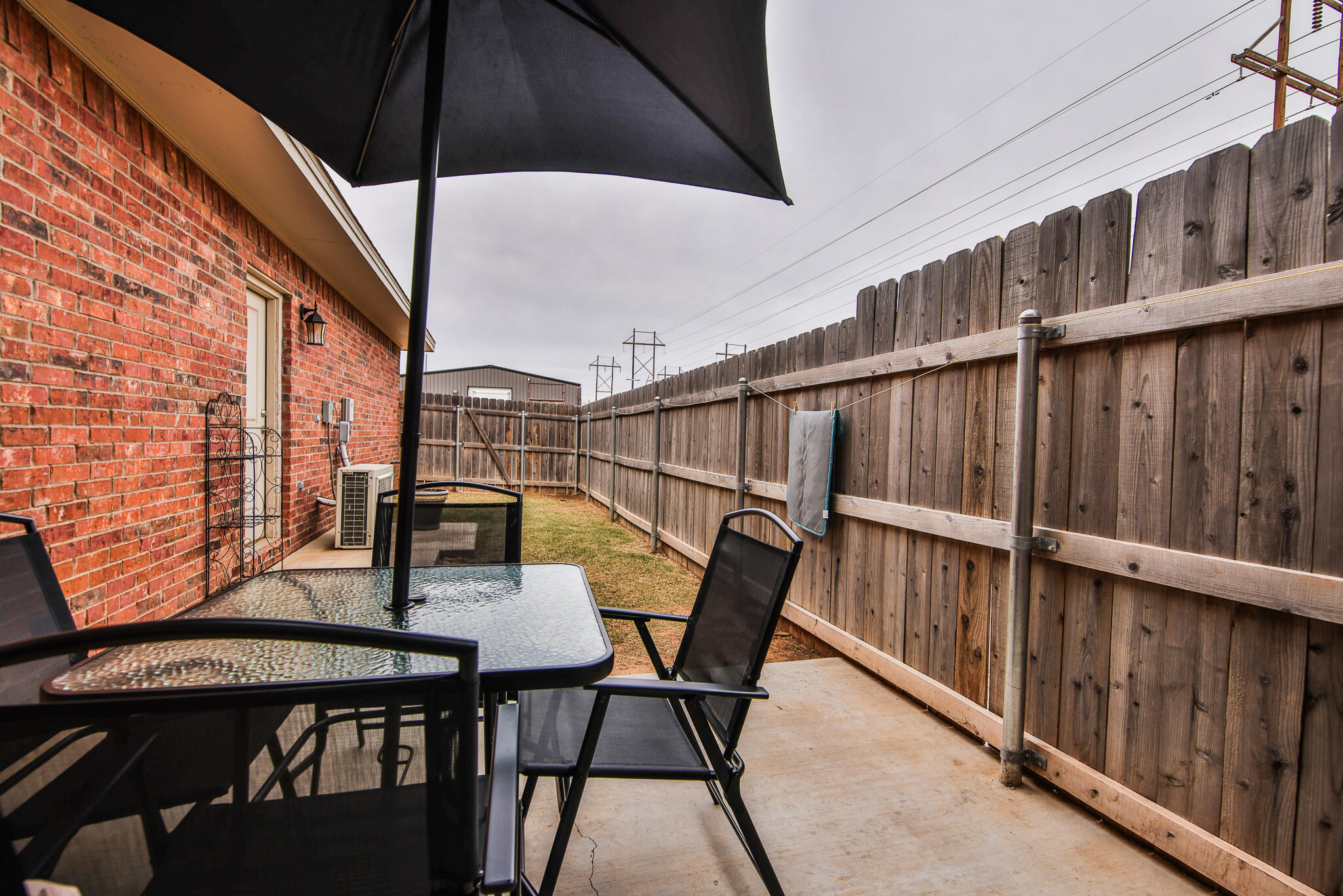 6902 20th Street Lubbock, TX 79407 - Photo 18 of 20 a balcony with table and chairs