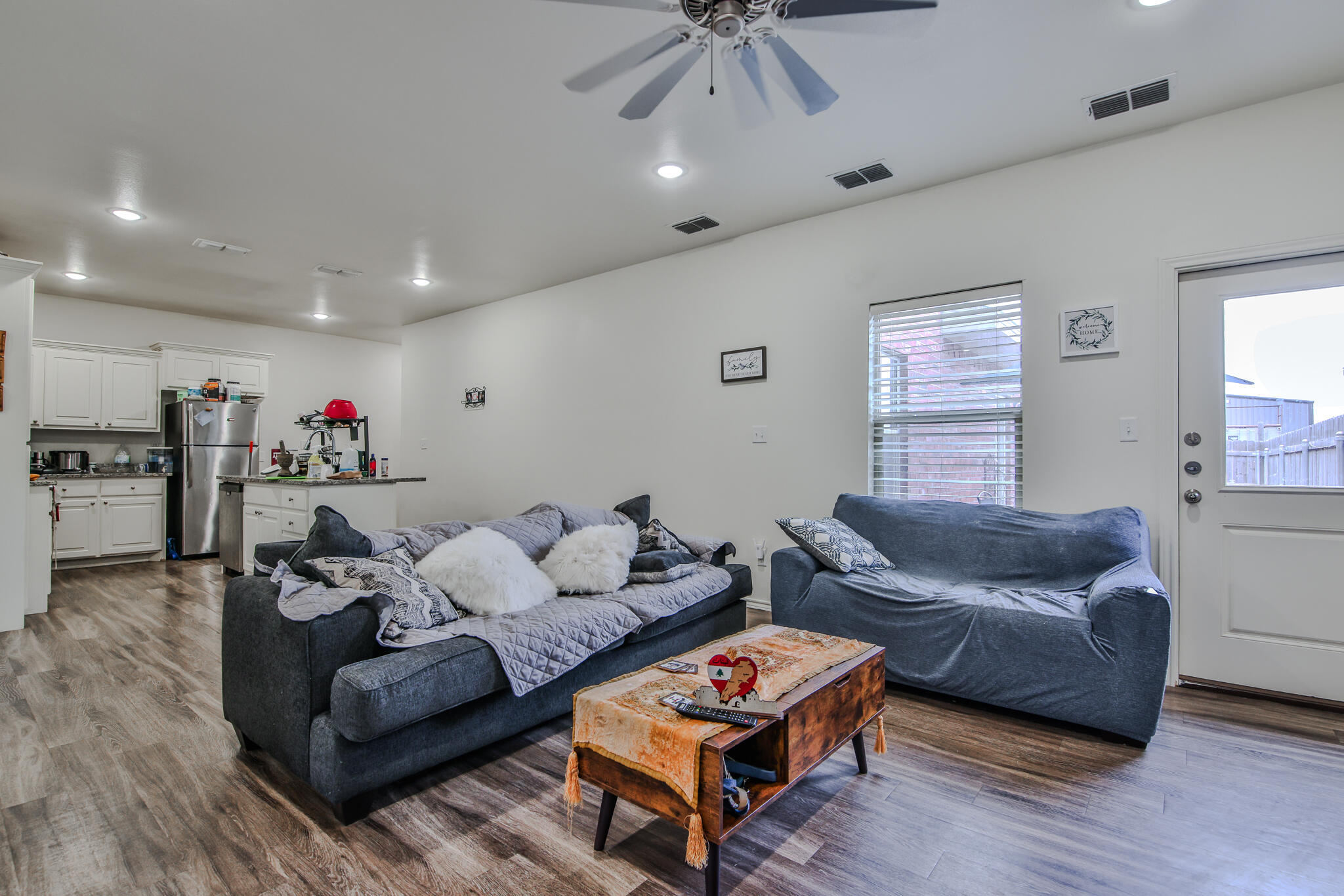 6902 20th Street Lubbock, TX 79407 - Photo 4 of 20 a living room with furniture and a flat screen tv