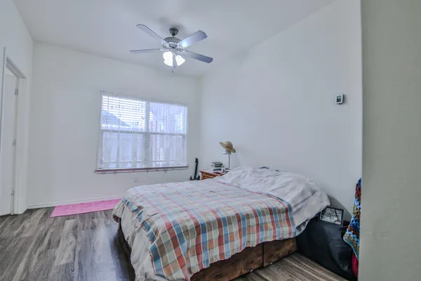 a bedroom with a bed and window