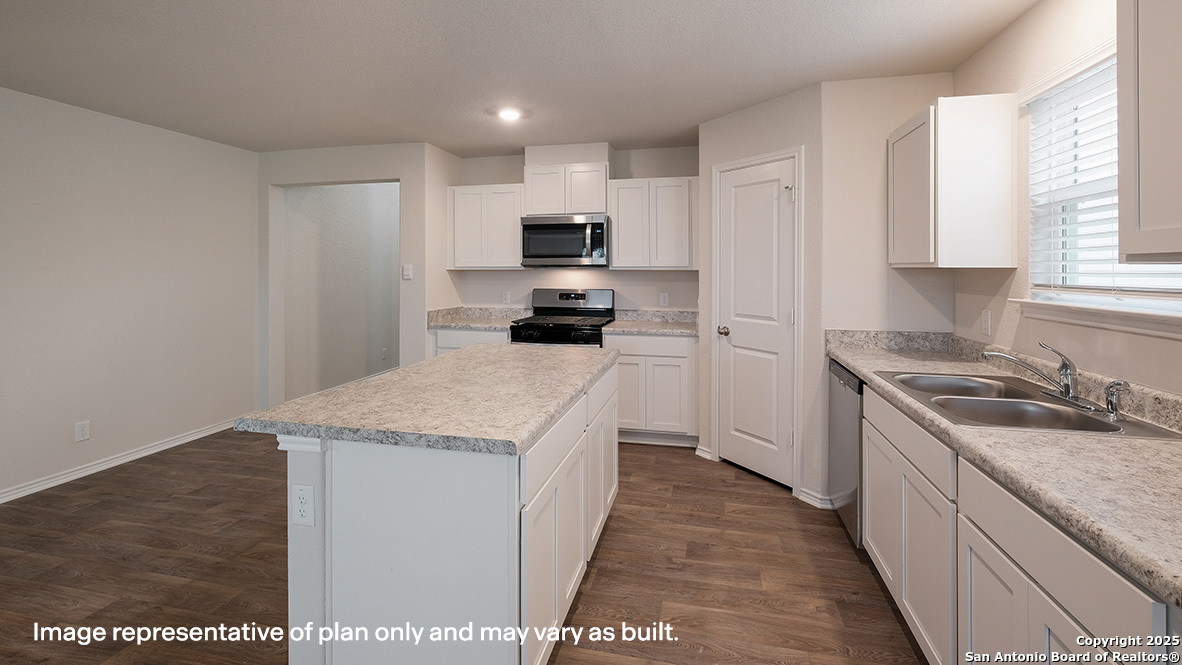 14790 Clay Rdg Run San Antonio, TX 78253 - Photo 5 of 28 a kitchen with granite countertop a sink and steel appliances
