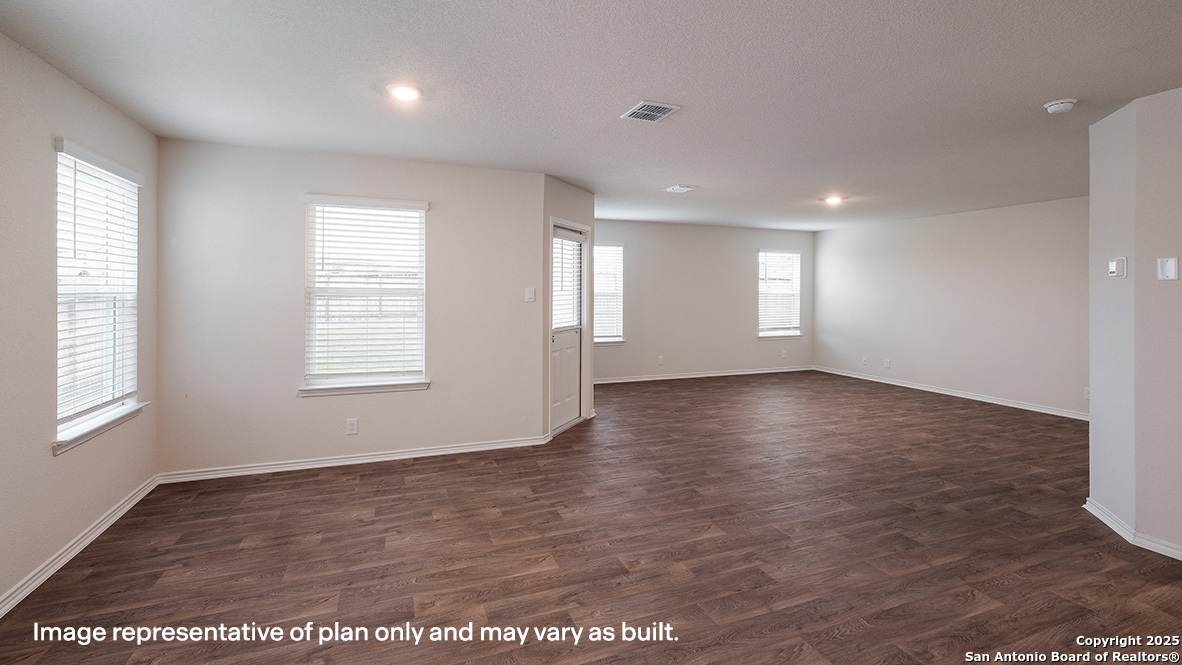 14790 Clay Rdg Run San Antonio, TX 78253 - Photo 7 of 28 an empty room with wooden floor and windows