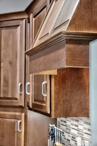 a living room with furniture a rug and a chandelier