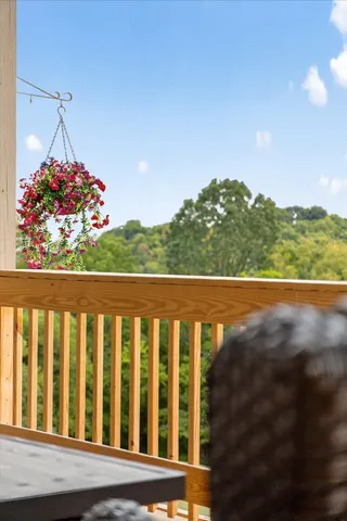 a view of a livingroom with furniture and a ceiling fan