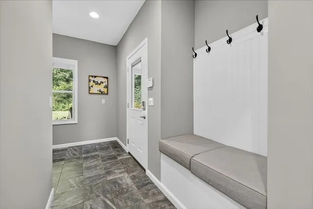 a kitchen with a stove sink and cabinets