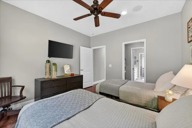 a view of a roof deck with couches and wooden floor