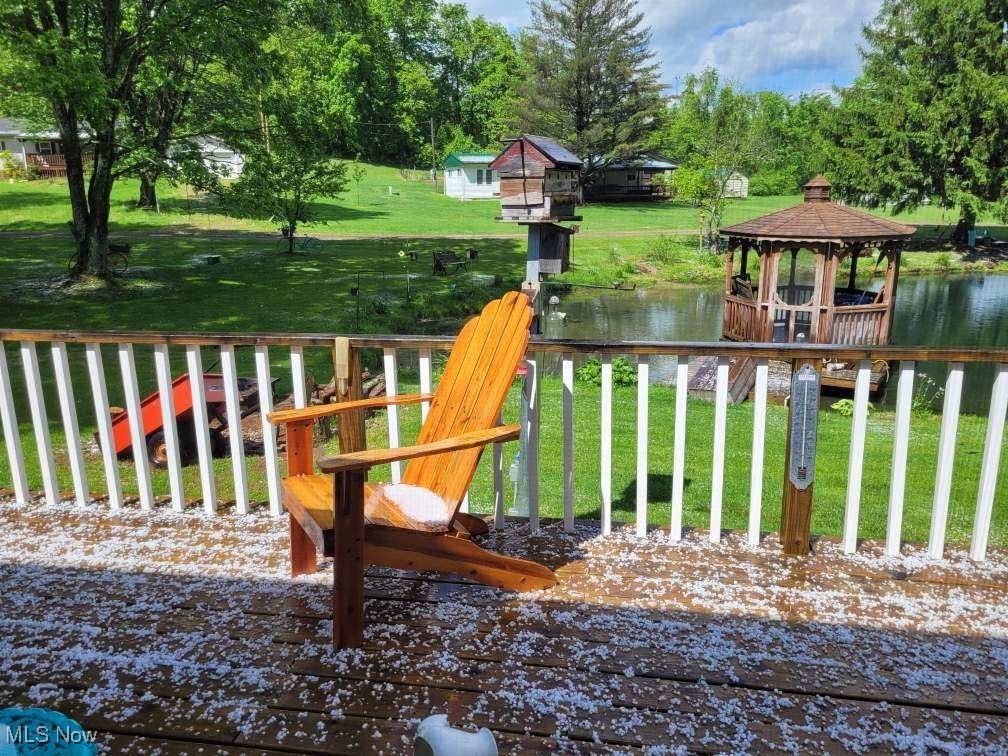 57894 Flamingo Road Senecaville, OH 43780 - Photo 6 of 20 Wooden terrace featuring a gazebo, a lawn, and a water view