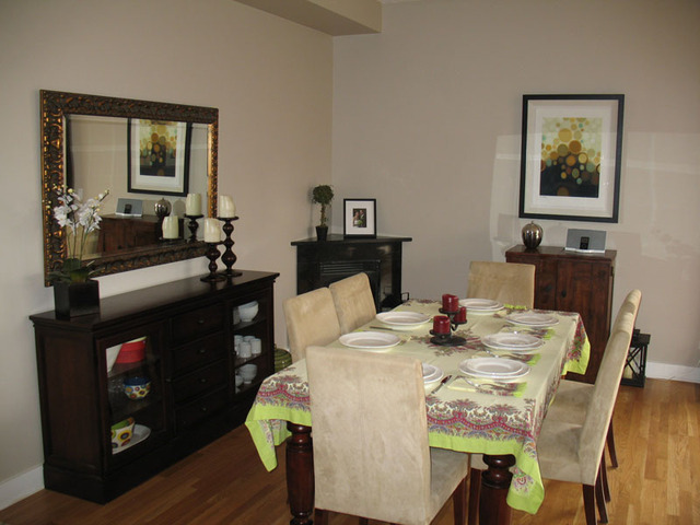 6 North May Street, Unit 201 Chicago, IL 60607 - Photo 4 of 10 a dining room with a table chairs and a kitchen view