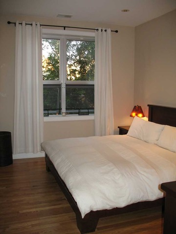 6 North May Street, Unit 201 Chicago, IL 60607 - Photo 5 of 10 a bedroom with a bed and a window