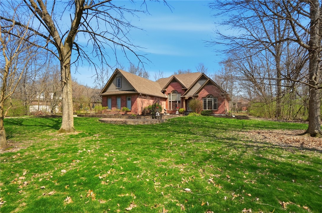472 Timber Walk Court Springboro, OH 45066 - Photo 63 of 86 This classic brick residence sits gracefully amidst expansive greenery, offering serene curb appeal.