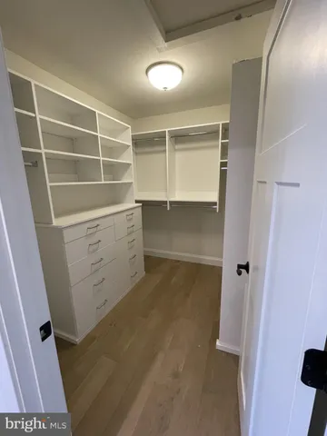 a view of an empty walk in closet