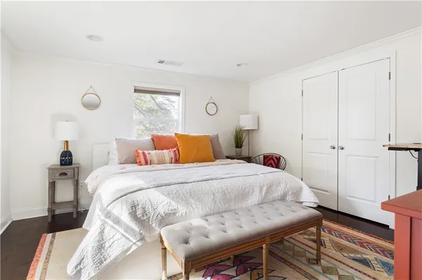 a bedroom with a bed and a table in it