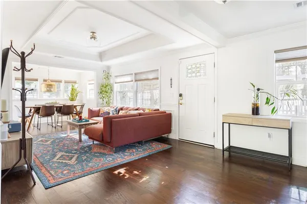 a living room with furniture and a table