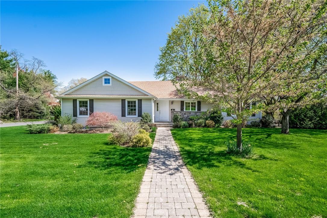 19 Rock Ridge Drive Rye Brook, NY 10573 - Photo 1 of 1 a front view of a house with a yard